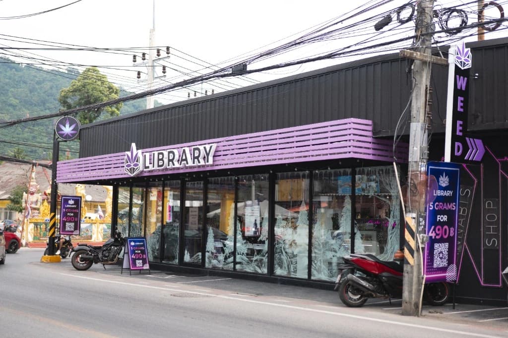 Library storefront exterior with purple branding and signage