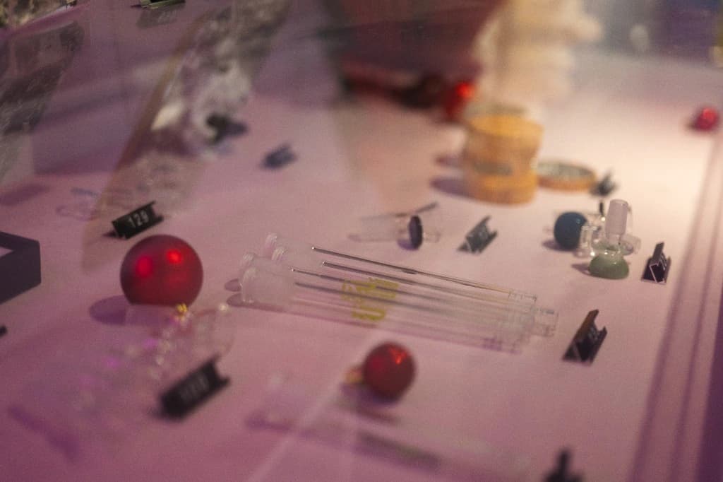 Glass accessories and retail display with soft purple lighting